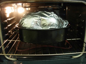foil covering stuffed turkey for roasting